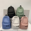 高校生のシンプルな無地のカジュアルリュックサック。アウトドア通勤に適しており、広々としていて、軽量で、汎用性があり、ラップトップ用に設計されています。