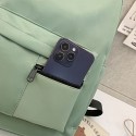 高校生のシンプルな無地のカジュアルリュックサック。アウトドア通勤に適しており、広々としていて、軽量で、汎用性があり、ラップトップ用に設計されています。